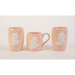 PAIR OF JOHNSON BROTHERS ROYAL COMMEMORATIVE PINK POTTERY BEAKERS, 1937, each applied in white