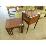 A NEST OF THREE MAHOGANY OBLONG COFFEE TABLE AND A MAHOGANY SQUARE SEWING TABLE WITH LIFT-UP TOP,