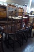 A DARK WOOD PRIORY JACOBEAN STYLE DINING ROOM SUITE OF 10 PIECES, TO INCLUDE; A LARGE DISPLAY
