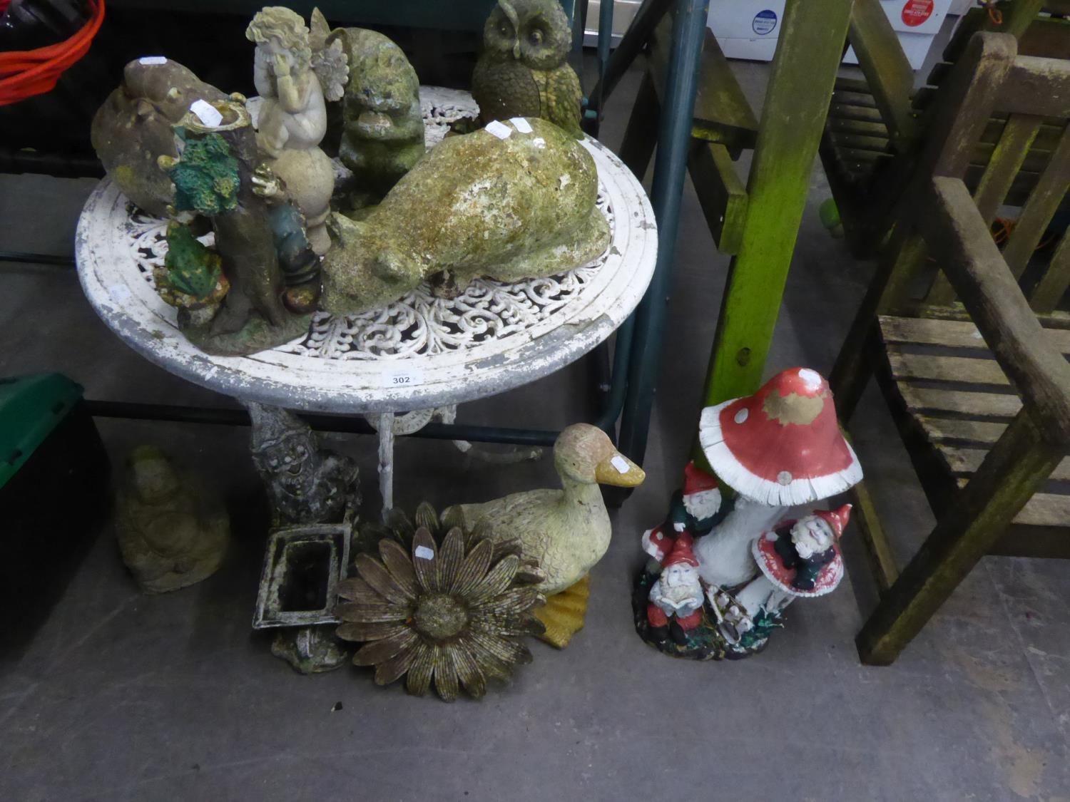 A WHITE FINISH METAL CIRCULAR GARDEN TABLE, AND VARIOUS GARDEN ORNAMENTS, GNOMES, DUCKS ETC...