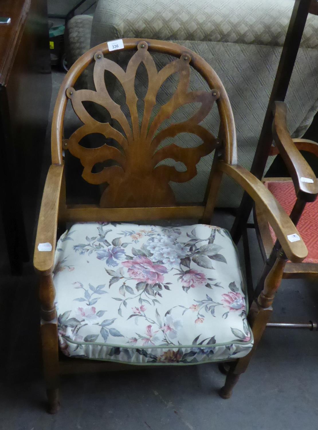 AN OAK LOW NURSING CHAIR, THE BACK HAVING FAN DESIGN