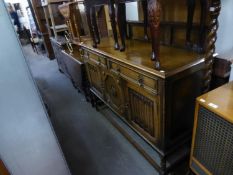 JACOBEAN STYLE CARVED OAK SIDEBOARD WITH LEDGE BACK, TWO DRAWERS OVER THREE DOORS, TWO WITH LINEN