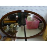 A LARGE OVAL BEVELLED EDGE WALL MIRROR, IN MAHOGANY FRAME, WITH BOX WOOD STRING INLAY, 2?8? WIDE