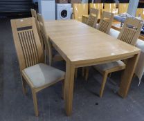 A LIGHT OAK ARGUS RANGE OBLONG DINING TABLE WITH ONE LOOSE LEAF AND A SET OF SIX SINGLE CHAIRS, WITH