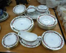 THIRTY FIVE PIECE ROYAL WORCESTER ?HOLLY RIBBONS? PATTERN POTTERY DINNER SERVICE FOR SIX PERSONS,
