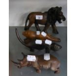 A CARVED EBONY MODEL OF A LION AND THREE OTHER CARVED ANIMALS (4)