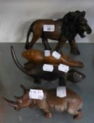 A CARVED EBONY MODEL OF A LION AND THREE OTHER CARVED ANIMALS (4)