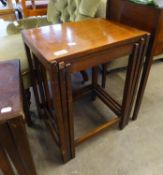 A NEST OF THREE MAHOGANY OBLONG COFFEE TABLES, ON STRAIGHT LEGS WITH BOX STRETCHERS