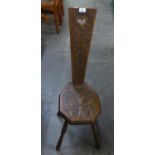 EARLY TWENTIETH CENTURY CARVED OAK SPINNING CHAIR, the seat carved W&M D and dated 1937