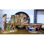 A BRETBY ART POTTERY JAPANESQUE WALL PLAQUE, A GERMAN BISQUE PORCELAIN FIGURAL GROUP AND AN EARLY