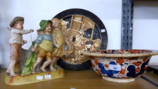 A BRETBY ART POTTERY JAPANESQUE WALL PLAQUE, A GERMAN BISQUE PORCELAIN FIGURAL GROUP AND AN EARLY