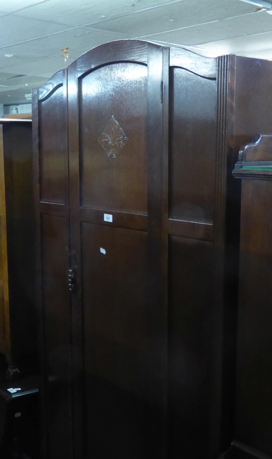 AN OAK HALLROBE WITH SHAPED TOP, SINGLE DOOR, 2?10? WIDE