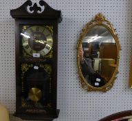 PRESIDENT QUARTZ DROP DIAL CHIMING WALL CLOCK, IN MAHOGANY CASE AND A GILT METAL FRAMED OVAL WALL
