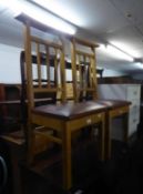 A PAIR OF OAK PRAYER CHAIRS, HAVING CRUCIFIX DESIGN TO  THE BACKS (2)