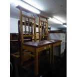 A PAIR OF OAK PRAYER CHAIRS, HAVING CRUCIFIX DESIGN TO  THE BACKS (2)