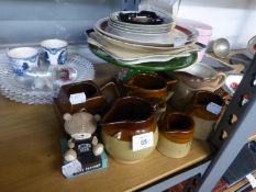 GERMAN GREEN AND FLORAL EMBOSSED PEDESTAL CAKE STAND; FIVE BROWN WARE JUGS, IN SIZES; A SET OF THREE