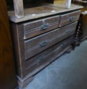 A STAINED PINE CHEST OF DRAWERS