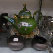 A BLACK BASALT CREAM JUG AND SUCRIER AND COVER, A GREEN GLAZED POTTERY JUMBO TEAPOT AND A BALLOON