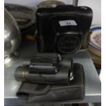 A PAIR OF 10 X 25 COMPACT BINOCULARS AND A ZENIT ? E SLR ROLL FILM CAMERA, IN CASE