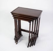 QUARTETTE NEST OF TWENTIETH CENTURY MAHOGANY OCCASIONAL TABLES, each with an oblong top with inset