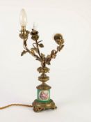 EARLY TWENTIETH CENTURY FRENCH PORCELAIN AND ORMOLU THREE LIGHT CANDELABRUM, the cylindrical base,