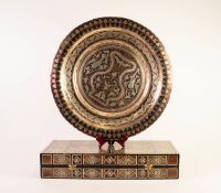 MIDDLE EASTERN COPPER AND WHITE METAL CIRCULAR WALL PLAQUE, decorated with stylised flowers and