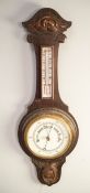 EARLY TWENTIETH CENTURY OAK ANEROID BANJO BAROMETER, the 6 ½? dial housed in a case with removable