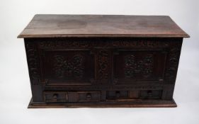 ANTIQUE CARVED OAK MULE CHEST, of typical form with moulded, three plank oblong top above a twin