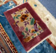 WASHED CHINESE SMALL PRE-WAR RUG with naturalistic flowering shrub and butterfly pictorial