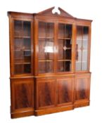 CHARLES BARR, EARLY TWENTIETH CENTURY CHERRY AND FIGURED MAHOGANY BREAKFRONT LIBRARY BOOKCASE, the