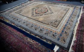 WASHED CHINESE EMBOSSED CARPET with diamond shaped and concentric circular centre medallion and bird