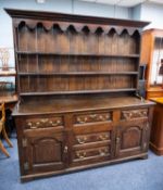 GEORGE III LATE EIGHTEENTH CENTURY OAK DRESSER WITH LATER PLATE RACK, the enclosed plate rack with