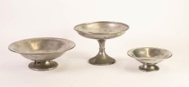 TUDRIC PEWTER GRADUATED PAIR OF PLANISHED DISHES, each of shallow footed form, stamped number: 01353