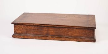 TWENTIETH CENTURY OAK CUTLERY BOX, of oblong form with lift up lid and three compartments to the