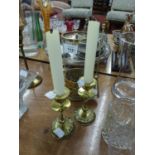 A BRASS PORTABLE CANDLE HOLDER WITH GLASS SHADE AND BRASS SNUFFER, A PAIR OF ARTS AND CRAFTS