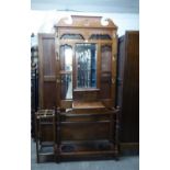 AN EARLY 20TH CENTURY MAHOGANY HALLSTAND WITH BEVELLED EDGE MIRROR AND BASAL SHELF, 35? WIDE AND