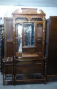 AN EARLY 20TH CENTURY MAHOGANY HALLSTAND WITH BEVELLED EDGE MIRROR AND BASAL SHELF, 35? WIDE AND