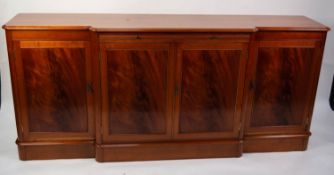 CHARLES BARR, EARLY VICTORIAN STYLE CHERRY AND FLAME CUT MAHOGANY BREAKFRONT SIDEBOARD, the shaped