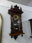 A WALNUTWOOD CASED VIENNA WALL CLOCK, HAVING ROMAN NUMERAL DIAL