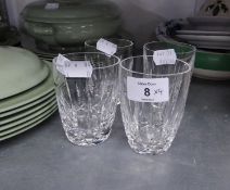 A SET OF FOUR WATERFORD CUT GLASS BARREL SHAPED TUMBLERS, BLADE CUT, WITH HEAVY DIAMOND CUT LOW BAND