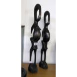 TWO AFRICAN CARVED EBONY STYLISED MALE AND FEMALE FIGURES, 21? HIGH