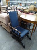 A LATE 19TH CENTURY AMERICAN PLATFORM ROCKING CHAIR, OF TYPICAL FORM BUT WITH ADDED SPRINGS TO THE