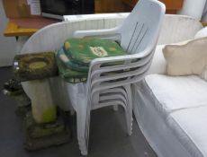 A SET OF FOUR WHITE PLASTIC STACKING GARDEN ARMCHAIRS WITH LOOSE CUSHIONS AND THE LARGE D-END