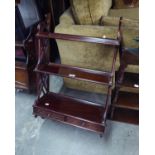 A REPRODUCTION SET OF WALL MOUNTED THREE TIER SHELVES WITH TWO SMALL BASAL DRAWERS