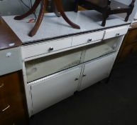 A WHITE PAINTED WOOD KITCHEN CABINET WITH FORMICA TOP, ON TV LEGS, CIRCA 1950'S