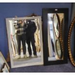 TWO PAINTED OBLONG WALL MIRRORS, one modern in heavy black frame, 43? x 19 ¾?, the other bevel edged