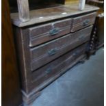 A STAINED PINE CHEST OF DRAWERS