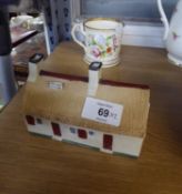 POSSIBLY W.H. GOSS, TINTED BISQUE MODEL OF ROBERT BURNS COTTAGE, with titled plaque to the roof,