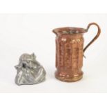 ARTS AND CRAFTS COPPER JUG, of vertical ribbed, cylindrical form with scroll handle and circular
