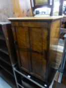 A SMALL FLAME MAHOGANY SINGLE DOOR CUPBOARD, LACKING SHELVES AND BACK PANEL